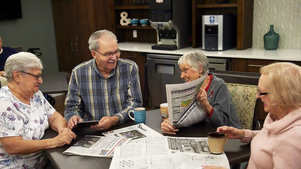 Residents reading the newspaper
