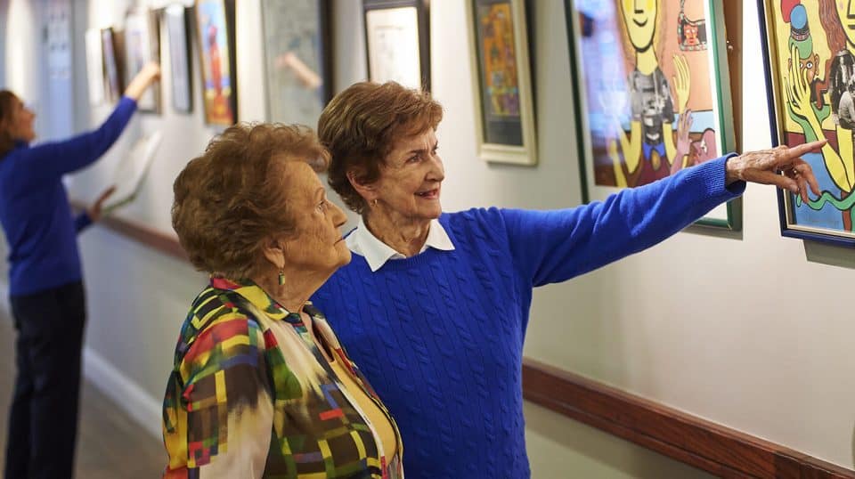 Residents looking at art