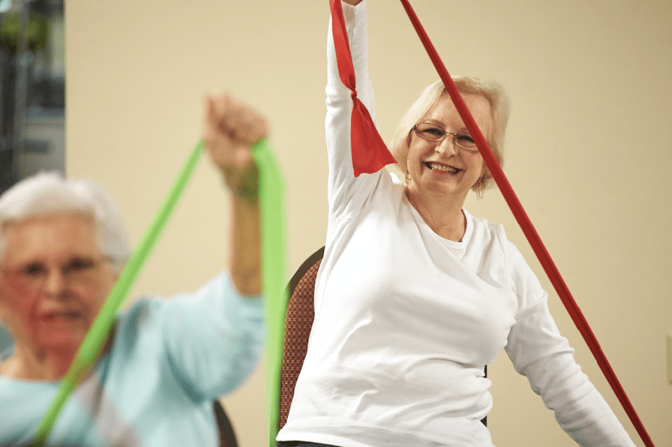 Seniors stretching in a fitness class